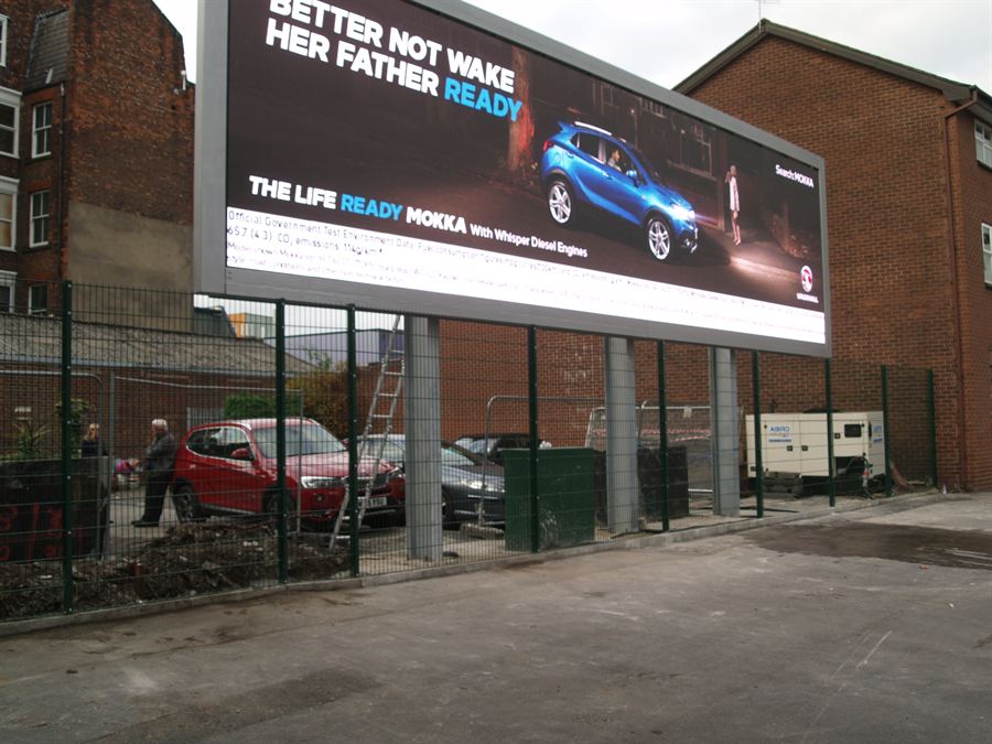 Mesh fencing installed to protect a digital advertising sign in Manchester city centre